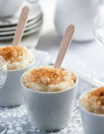 Bowls of rice pudding served with cinnamonの写真素材