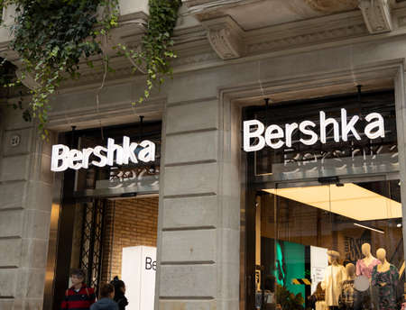 BARCELONA, SPAIN - NOVEMBER 23, 2019: Tourists enjoy shopping at the Bershka store in Barcelona.のeditorial素材
