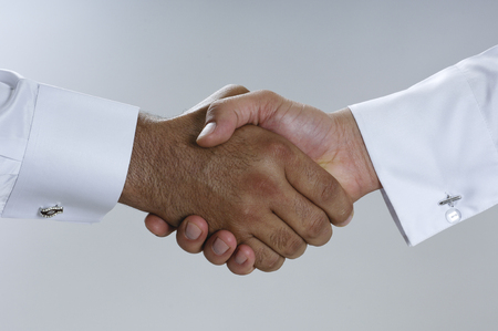 Saudi Arab Businessmen Hands Shaking, Making Agreement and Welcoming Closeupの写真素材