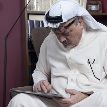 Portrait of - Washington Post's - Saudi journalist Jamal Khashoggi at his home in JEDDAH, SAUDI ARABIA - JAN 13, 2016のeditorial素材