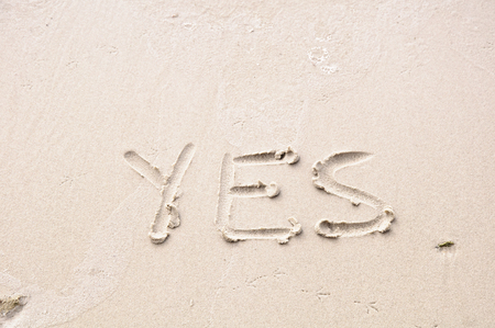 deutschen word YES - written in the sand - in the sunlightの写真素材