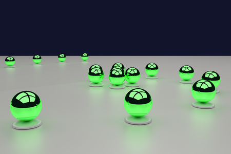 3D rendering of an assembly of glossy balls on a white surfaceの写真素材