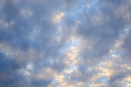white, pink and gray clouds in autumn evening sky just before sunsetの写真素材