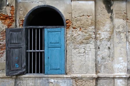 The old vintage window with old wall at urban.の写真素材