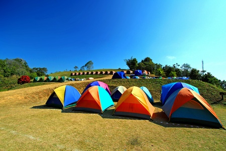 Many colorful tents prepared for tourist camping and sleeping at Sri Nan national park, Nan, Thailandの写真素材