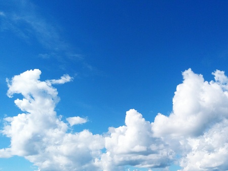 Beautiful blue sky and white clouds background with above copy space