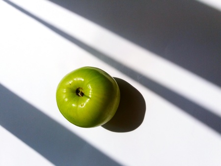 Green jujube or monkey apple isolated on white background with shadow and light. Art fruit and abstract conceptの写真素材