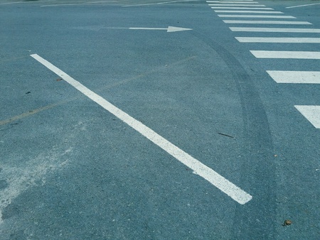Zebra crosswalk with white arrow line on asphalt road. Black, White and Gray style