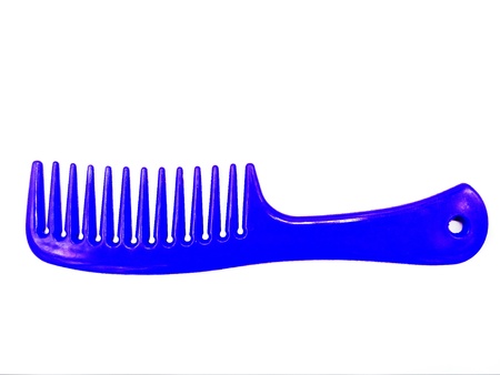 Close up Blue, Violet or Purple plastic comb isolated on white background. Beauty salon and tool conceptの写真素材