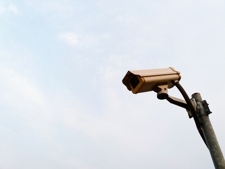 White surveillance camera or security cctv (Close Circuit Television) with installed on steel pole...