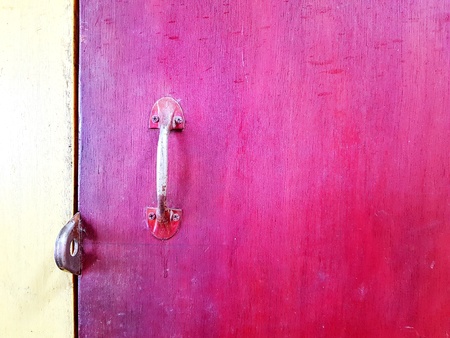 Stainless steel handle door on purple wooden background with copy spaceの写真素材