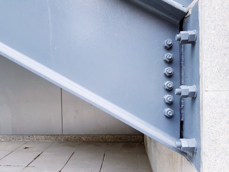 The gray metal foundation and concrete structure with bolt and nuts of staircase - Industrial and Build exterior conceptの写真素材