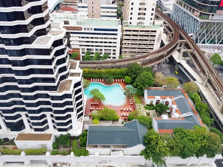 Top view center of Bangkok area seeing rail way transportation, exterior building, swimming pool and green plant tree - City scape view and Nature in the city conceptのeditorial素材