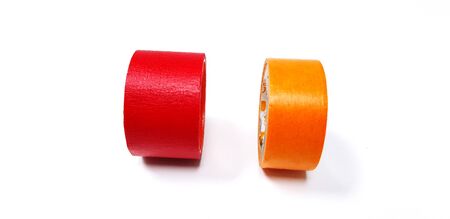Red and orange tape isolated on white backgroundの写真素材