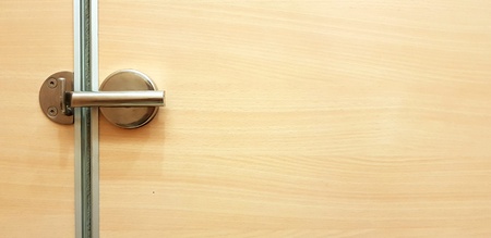 Wooden door and stainless steel locked and close with copy space - Background and Interior design conceptの写真素材