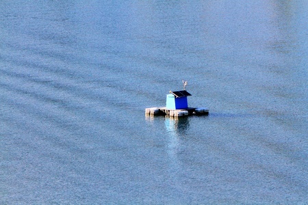 Solar cells are mounted or install on blue wreck buoy floating to provide energy or to shine at night on the sea with copy space - Technology, Device, Equipment and Object conceptの写真素材