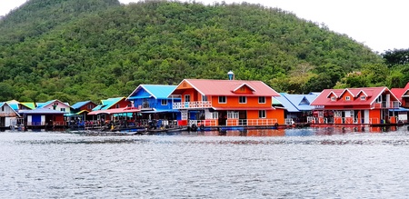 Many colorful village, house or resort floating on river with beauty of nature and green mountain background in Srinagarind Dam lake, Kanchanaburi, Thailand-Landmark of travel, Exterior design conceptのeditorial素材