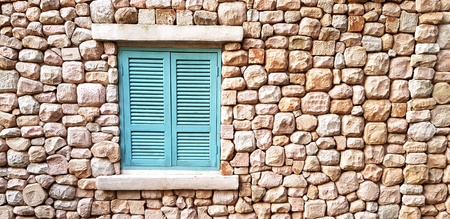 Light green vintage window on brown stone wall with copy space - Wallpaper, Background, Exterior design and Beautiful decoration conceptの写真素材
