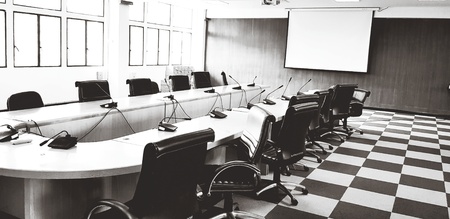 Many black chair, microphone and white monitor inside meeting room in black and white style - Art, Abstract, Interior design, Business, Seminar and Contact conceptの写真素材