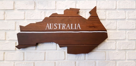 Brown Australia regional map wooden on white brick or stone wall for background - Material, Decoration, Art and wallpaper conceptの写真素材