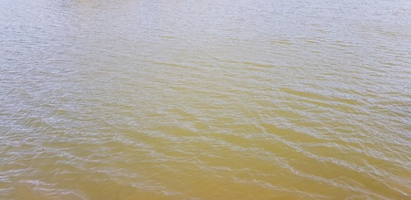 Beautiful river or lake and small wave from wind power for background at Jetkod Pongkonsao national...