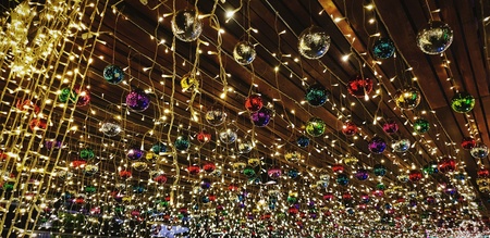 Beautiful decoration with colorful ball and lighting hanging on wooden ceiling for celebration or festival time - Happy new year, Merry Christmas and Funny party concept, Selective focusの写真素材