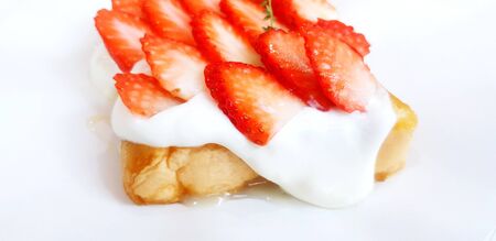 Strawberry cream toast isolated on white paper - selective focus, Dessert food and Fresh fruit