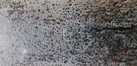 Art pattern of steam, vapor or water droplet on glass or mirror for background. Selective focus and...