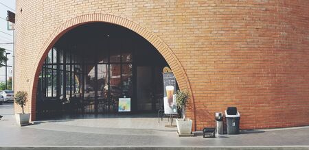 Ayuttaya, Thailand- January 26, 2018: Exterior design of Starbucks coffee shop in brown brick building style in vintage tone. Starbucks Corporation is an American global coffee company and coffeehouseのeditorial素材