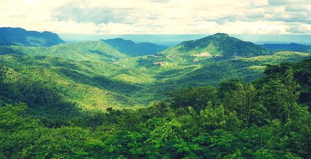 beautiful landscape of mountain. Green forest or jungle with mountain heel and cloud sky. Beauty of nature and Natural wallpaper conceptの写真素材