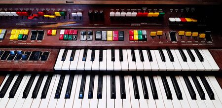 Old classic Electone or piano with panel in wooden style , keyboard and colorful button for setting...