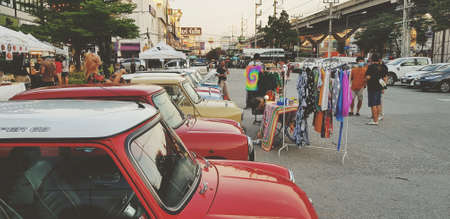 Bangkok, Thailand - June 20, 2020: Many classic mini Austin parking with dress shop on the local street market. Vintage cooper car or Retro vehicle with shopping landmarkのeditorial素材
