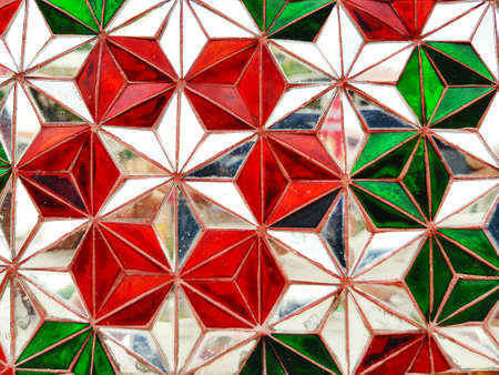 The pattern of colorful glass and Abstract background or wallpaper in Thai temple. Geometric shapeの写真素材