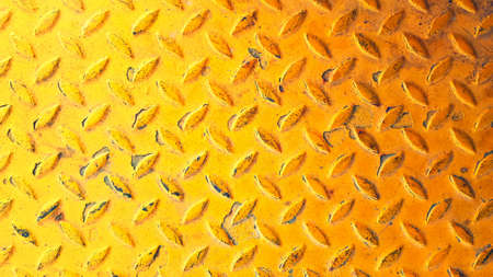 Yellow stainless steel background Seamless pattern of rust iron wall or wallpaper. Textured or grunge panel and Hard material concept.の写真素材