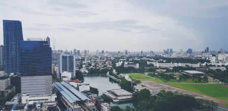 à¸ºBangkok,Thailand - July 28, 2021: Top or Aerial view of building, rooftop, street or road and...