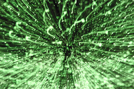 Blurred green light background. Abstract art of lighting blur wallpaper at festival. Defocus and...