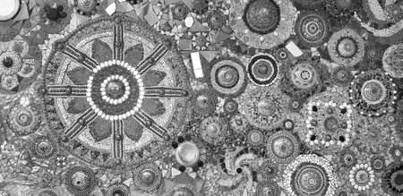 Abstract wall decorated with stone, gravel and gem for background at Wat Phra That Pha Son Kaew in monochrome style. Art design with broken tile for wallpaper in black and white toの写真素材
