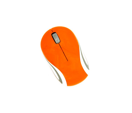 Top view of used orange and white wireless or computer mouse isolated on white background with clipping path or make selection. Technology, Flat lay of Electronic deviceの写真素材