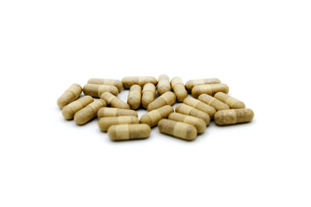 White or brown pills or capsule isolated on white background. Group of object. Medicine, food supplement or herb for cure or repair health.の写真素材
