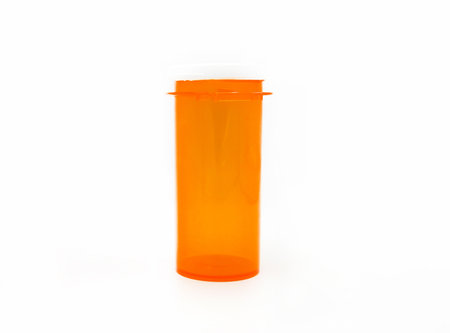 Red or orange plastic or glass for contain pills or capsule bottle isolated on white background. Object for container and shape.の写真素材