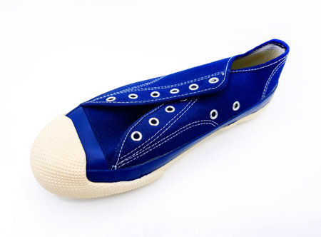 Blue sneakers isolated on white background. Vintage shoe, design object and comfortable for wearing.の写真素材