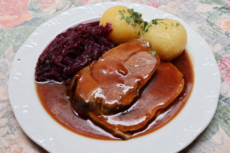 German cuisine: schweinsbraten (roast pork) in Rothenburg ob der Tauber, Germanyの写真素材