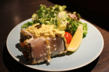 Japanese cuisine: sawara (Japanese Spanish mackerel) rare cutlet with tartar sauce in Kurashiki, Japanの写真素材