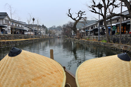 Cityscape viewed from a boat in Kurashiki Bikan Historical Quarter (old town) in Japanの写真素材