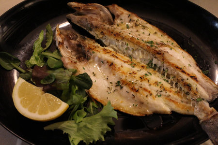 Italian cuisine: grilled sea bass in Venice, Italy