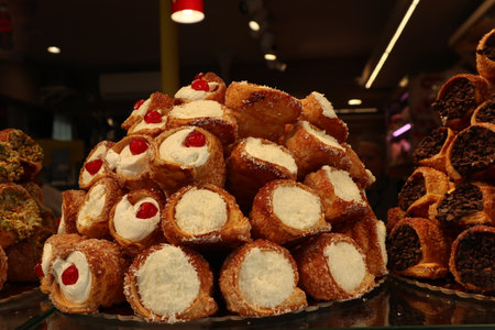 Pastry vitrine filled with varieties of cannoli in Venice, Italy