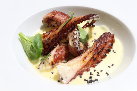 Italian cuisine: grilled octopus with cream of potatoes in Murano, Italy
