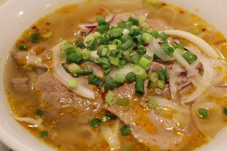 Vietnamese cuisine: pho bo hue (spicy rice noodles with beef)