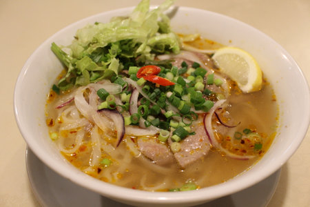 Vietnamese cuisine: pho bo hue (spicy rice noodles with beef)の写真素材