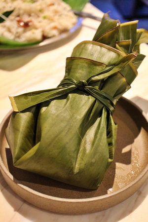 Indian cuisine: prawn curry in banana leavesの写真素材